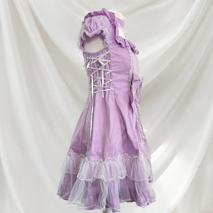 Bodyline lilac dress with ruffled hem dress with a bow and cross-tie detail 2