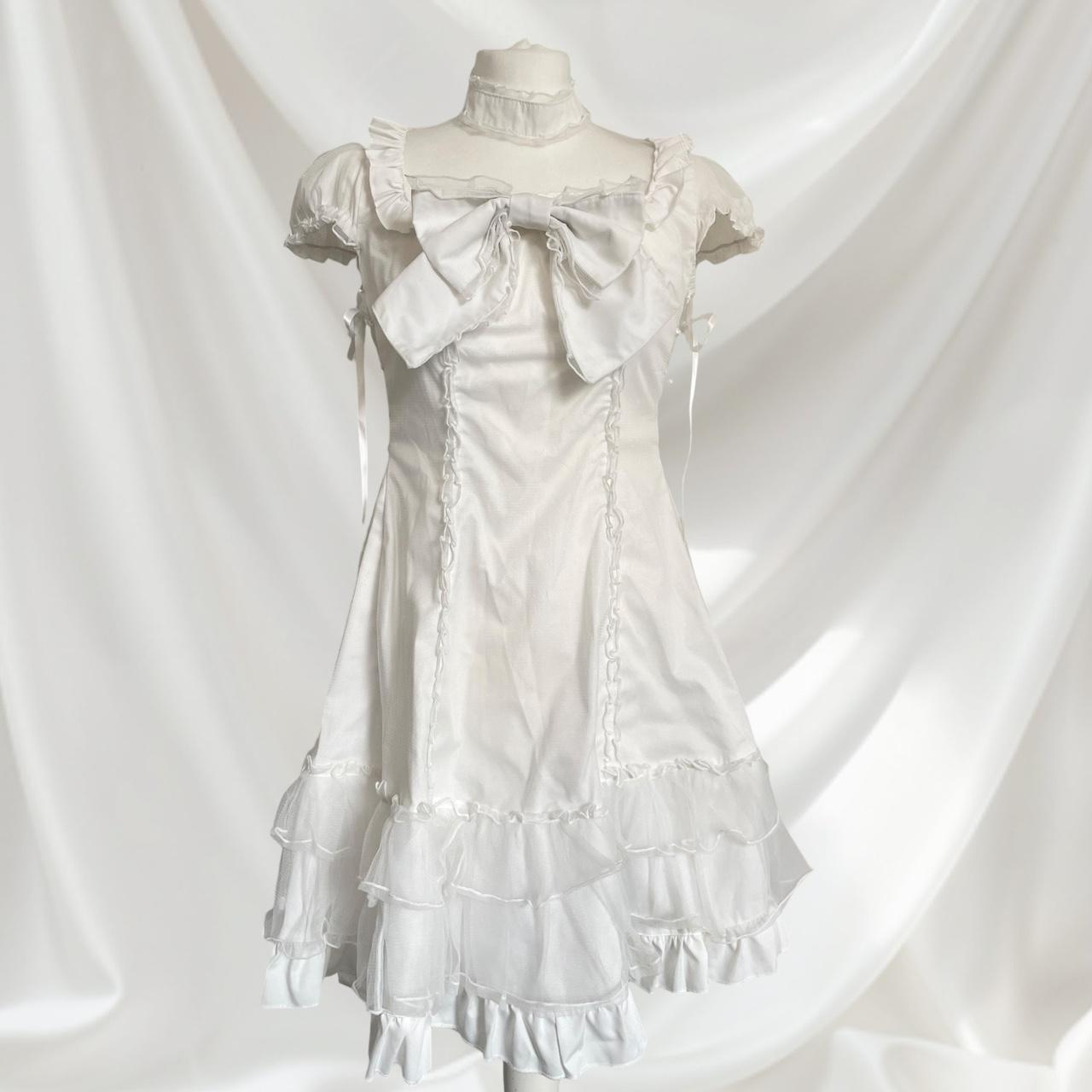 Bodyline white dress with a detachable bow and cross-tie detail1