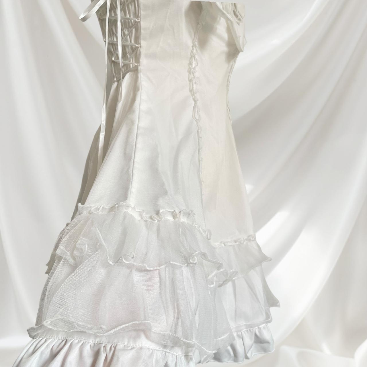 Bodyline white dress with a detachable bow and cross-tie detail5