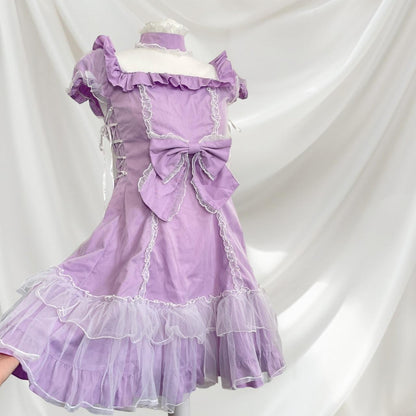 Bodyline lilac dress with ruffled hem dress with a bow and cross-tie detail 0