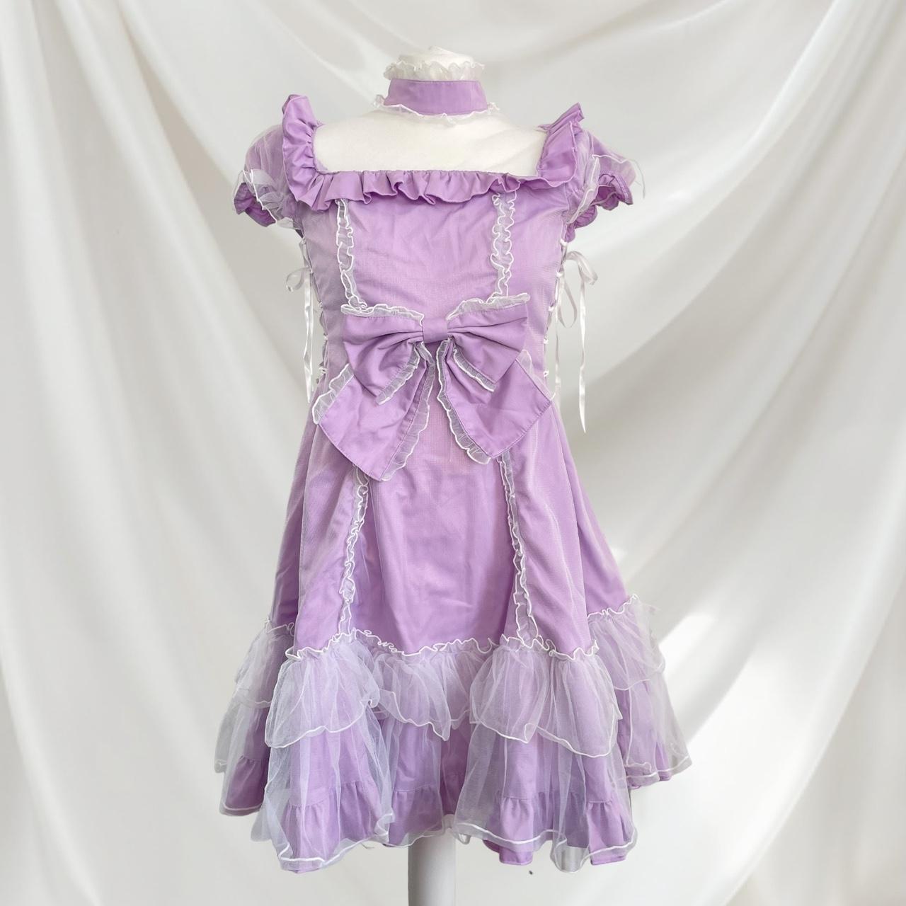 Bodyline lilac dress with ruffled hem dress with a bow and cross-tie detail 1