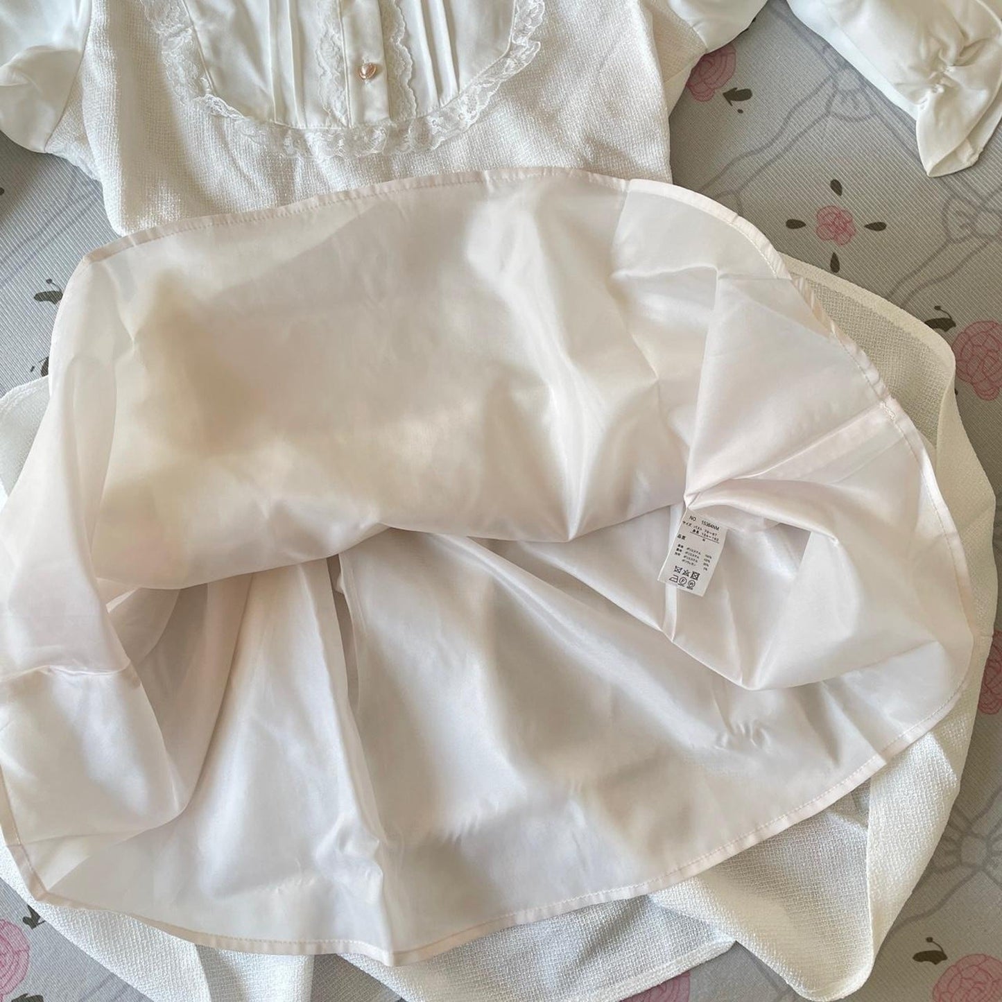 Noemie Jirai Kei ivory dress with a frilled high collar4