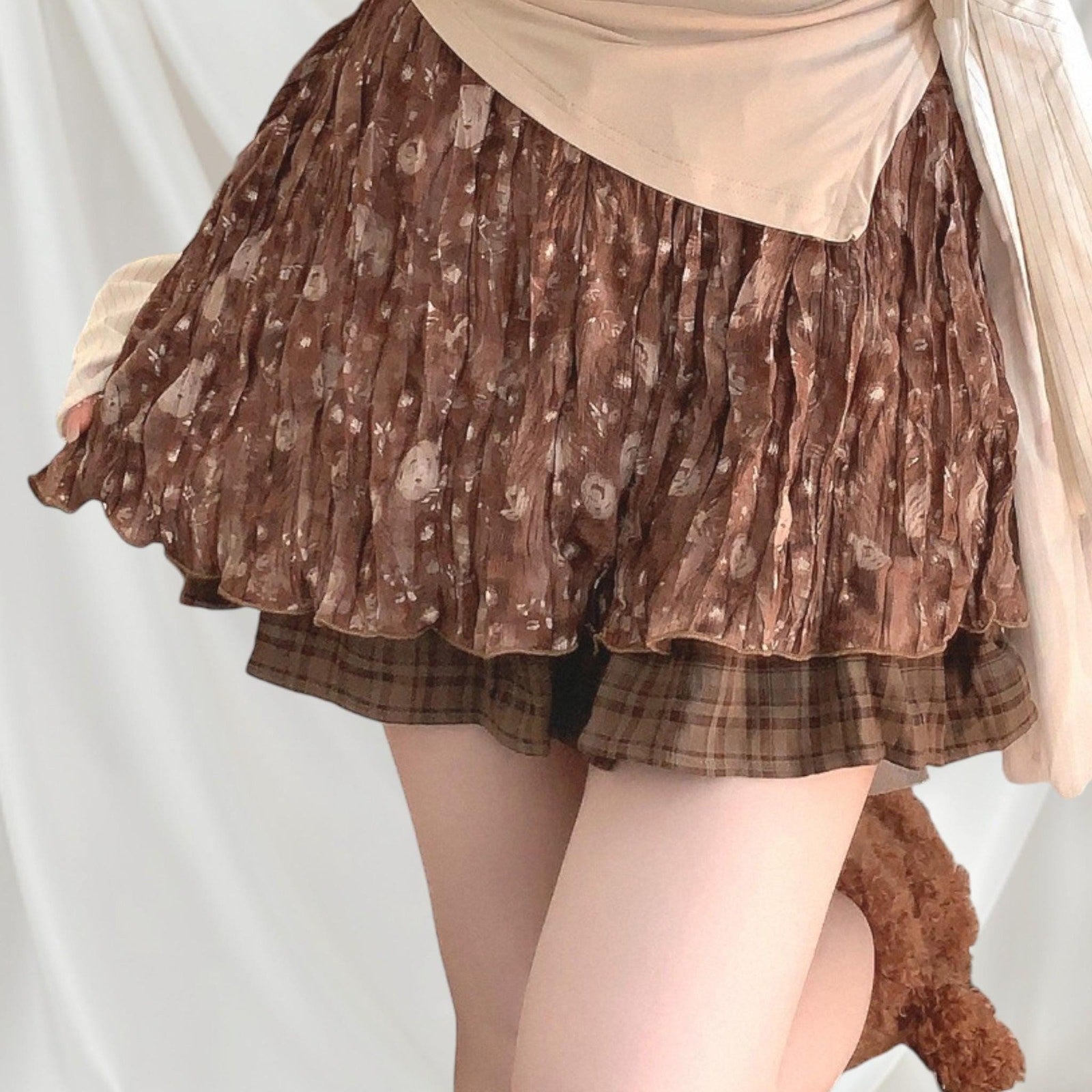 Layered brown pleated skirt with a plaid underlayer0