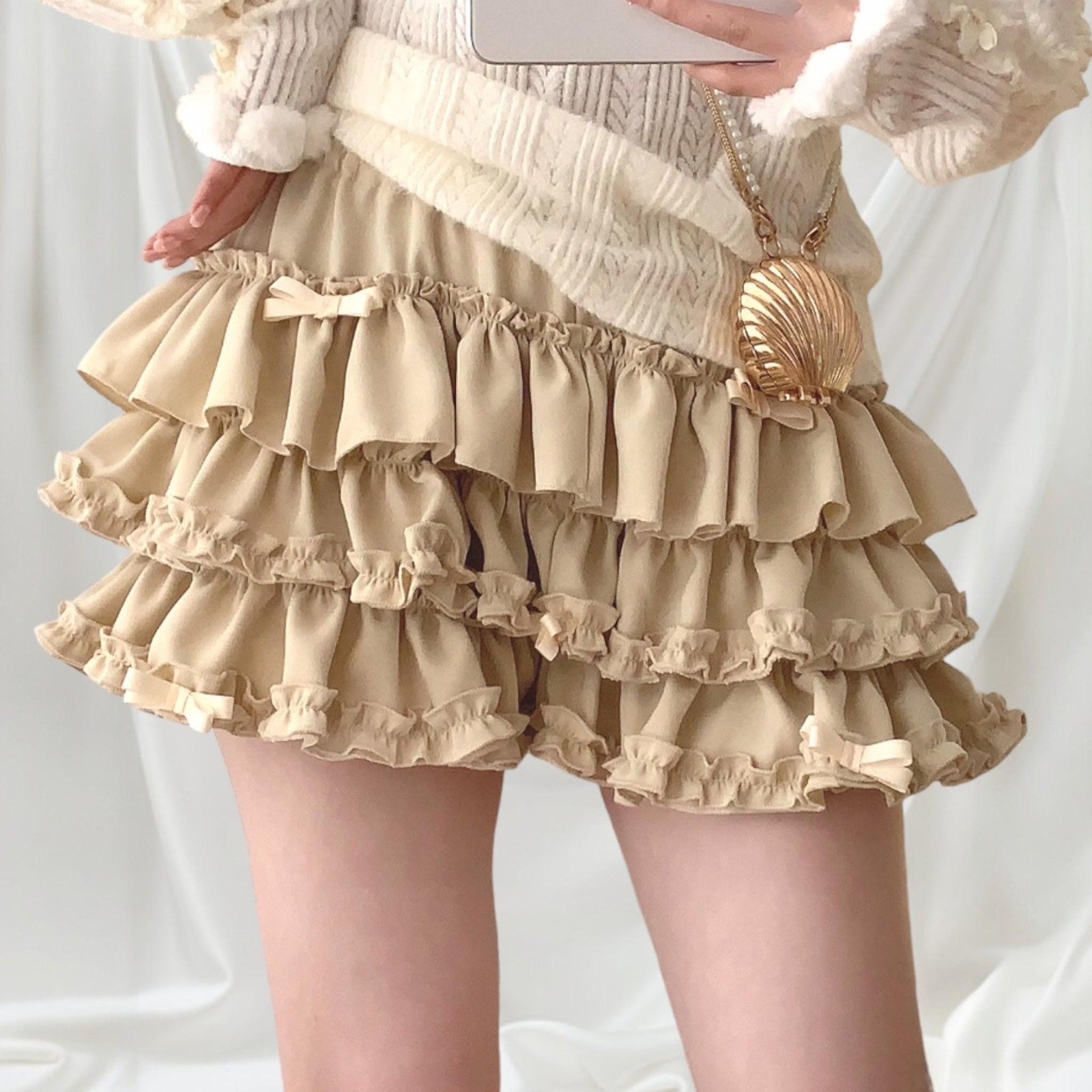 Beige ruffle tiered mini skirt/skort with bow details0