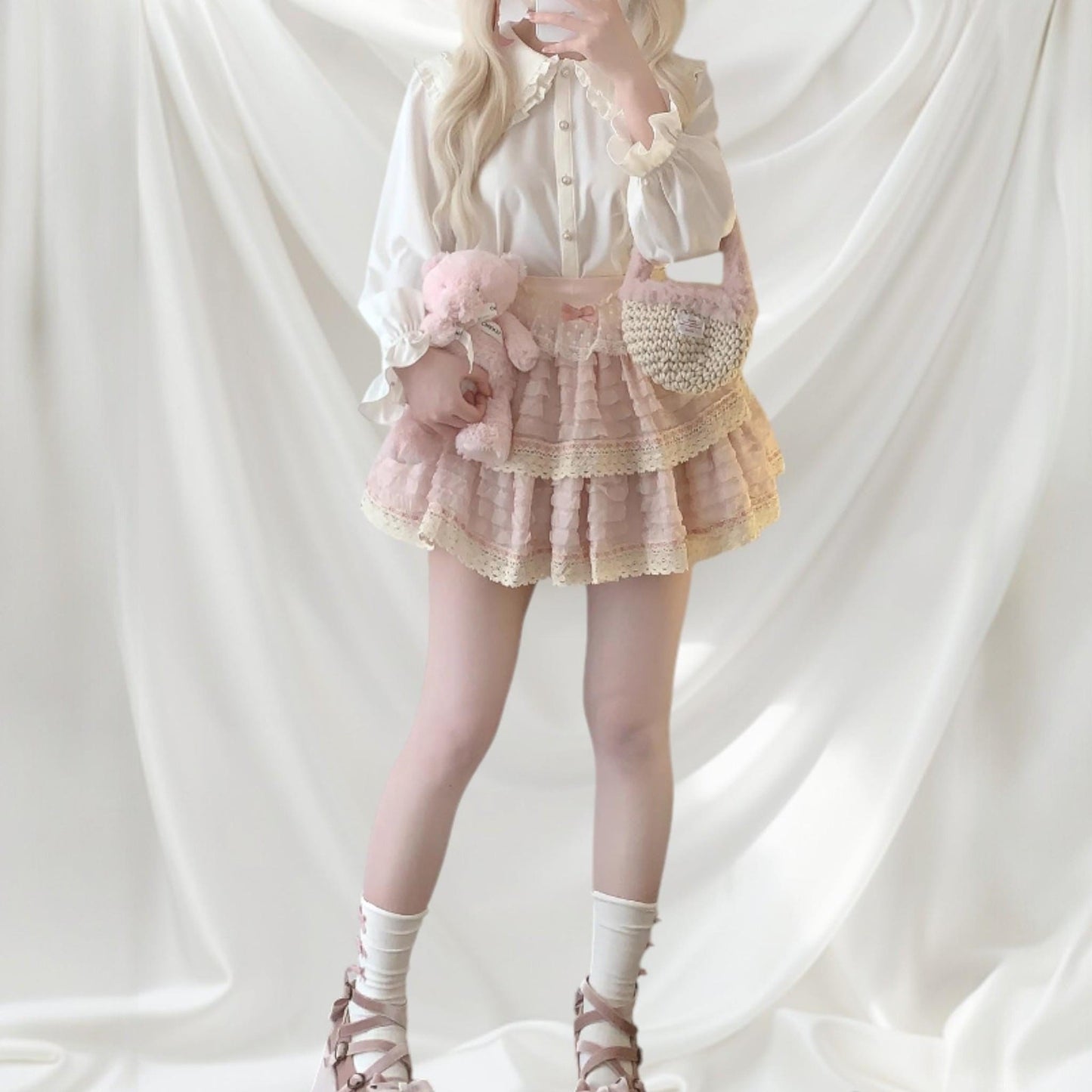 Layered lace ruffle mini skirt with intricate lace trim in soft pink2