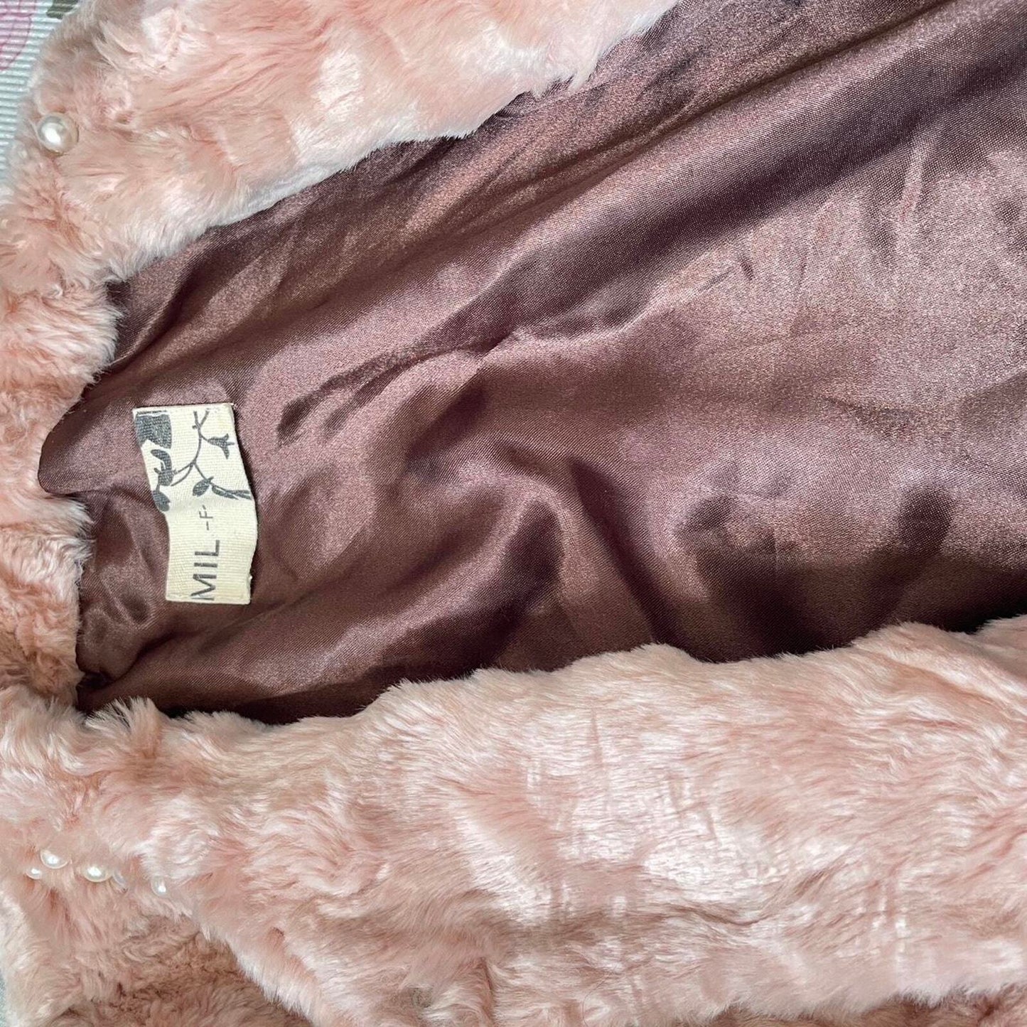 Soft pink faux fur jacket with pearl details from Japanese brand MIL3