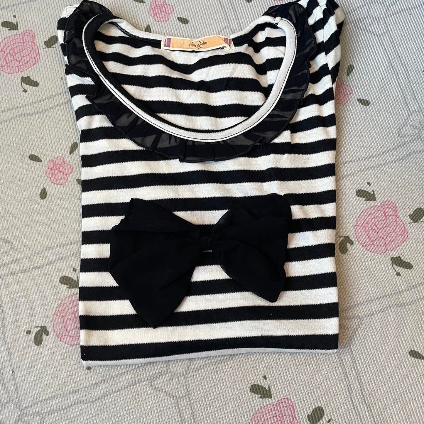 Black and white striped top with black bow and ruffled neckline 5
