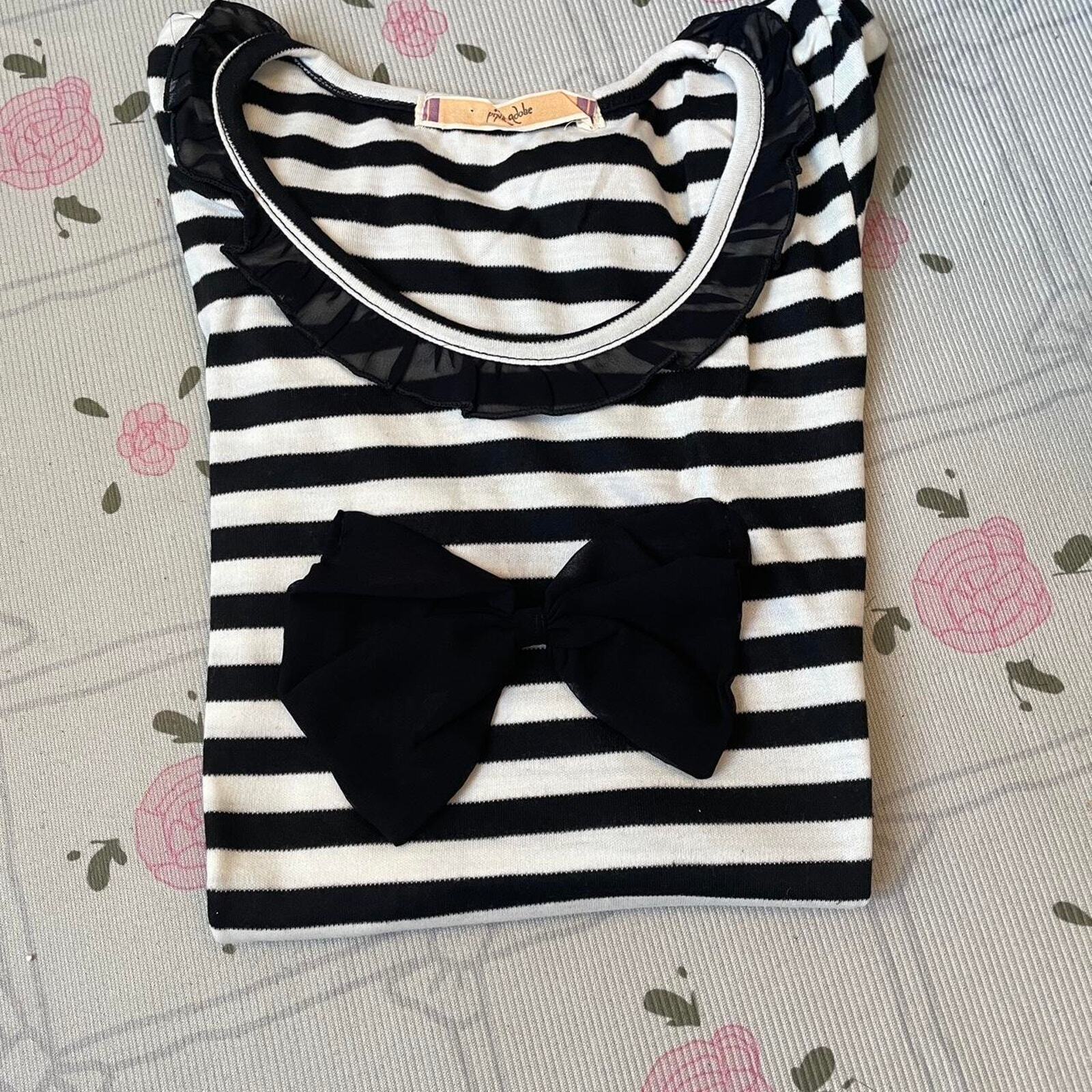 Black and white striped top with black bow and ruffled neckline 5