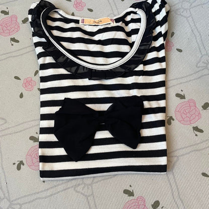 Black and white striped top with black bow and ruffled neckline 5