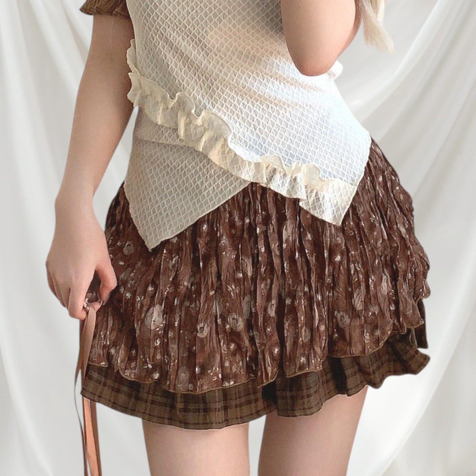 Layered brown pleated skirt with a plaid underlayer2