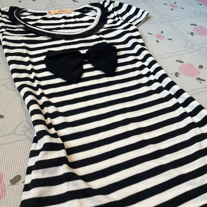 Black and white striped top with black bow and ruffled neckline 2