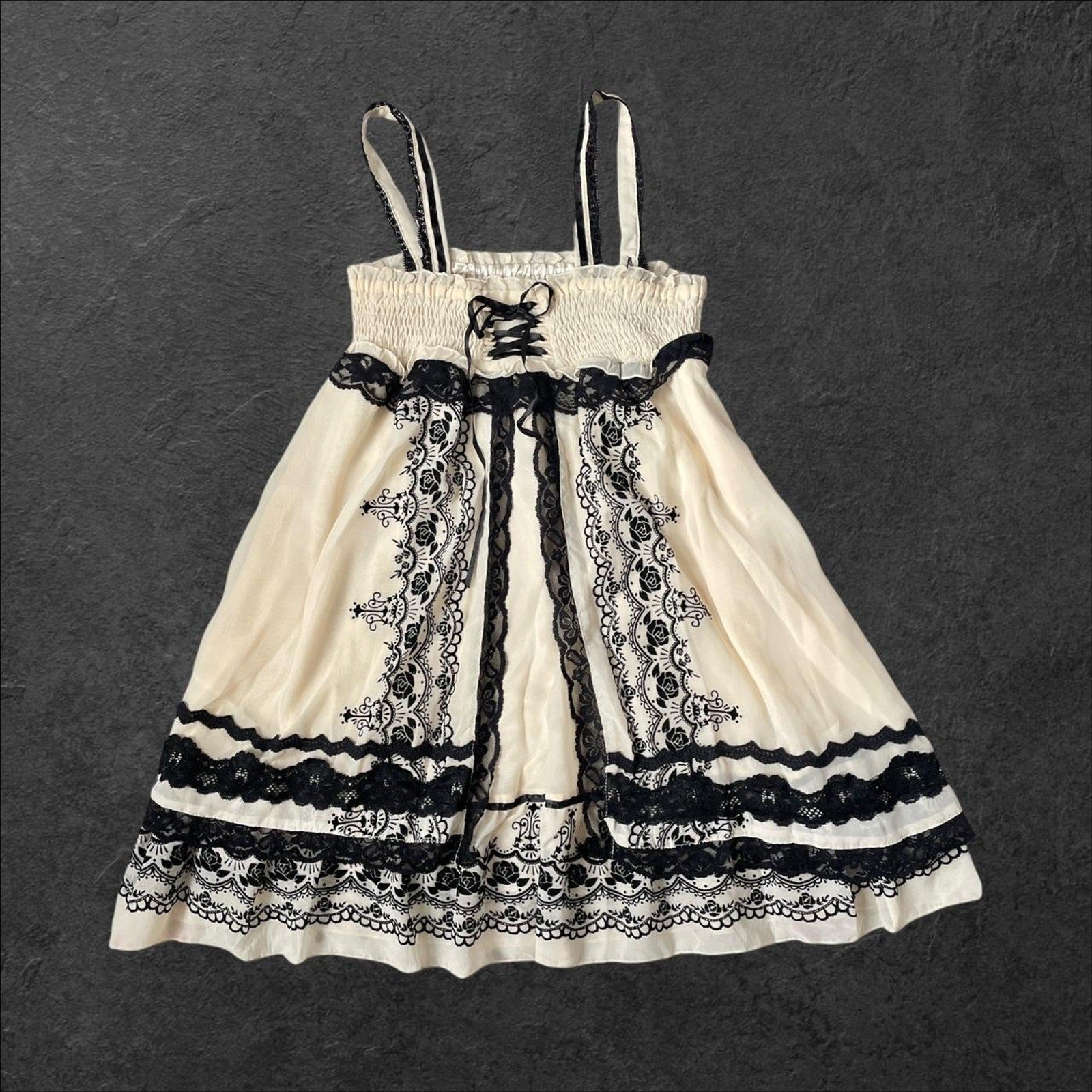 Axes Femme beige dress with rose pattern, laceup front and black lace detailing1