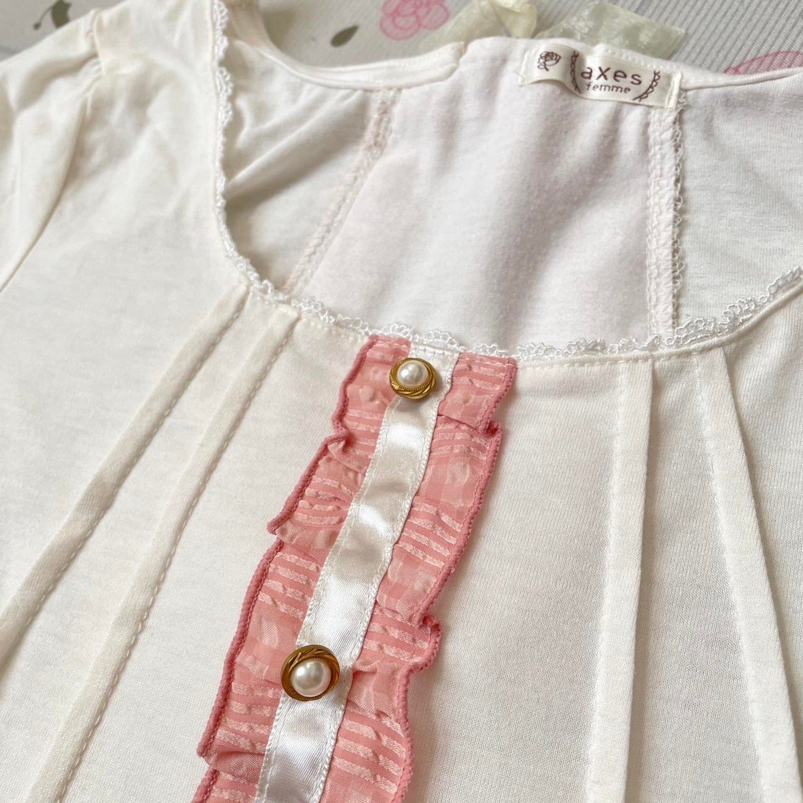 Axes Femme white and pink frill-back top with bow accents2