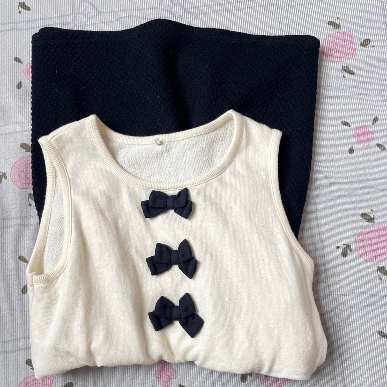 Cream and dark blue sleeveless mini dress/ top from Japanese brand kumikyoku 3