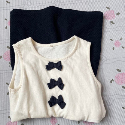 Cream and dark blue sleeveless mini dress/ top from Japanese brand kumikyoku 3