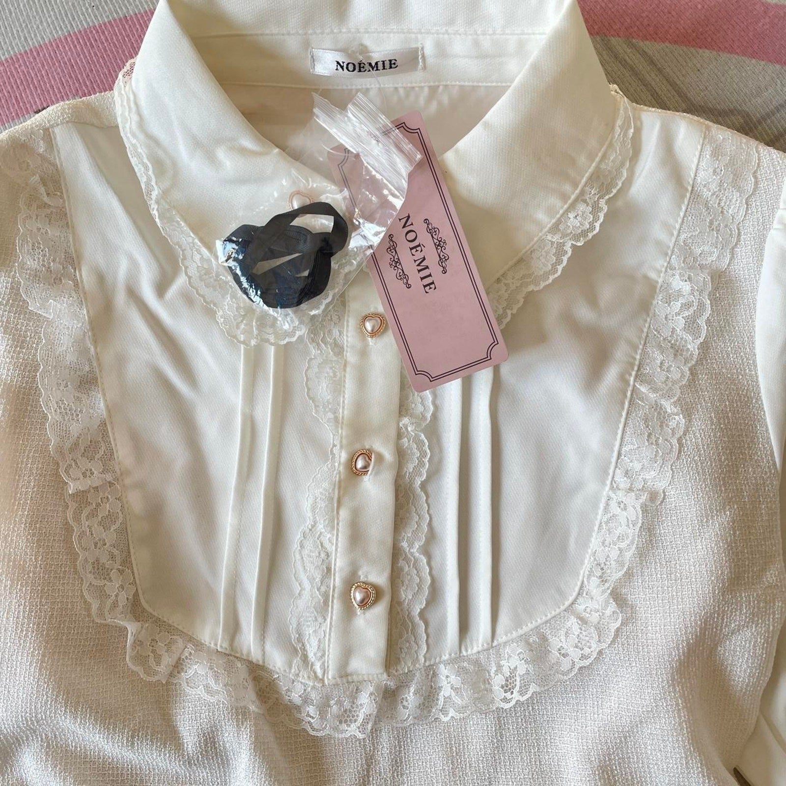 Noemie Jirai Kei ivory dress with a frilled high collar3