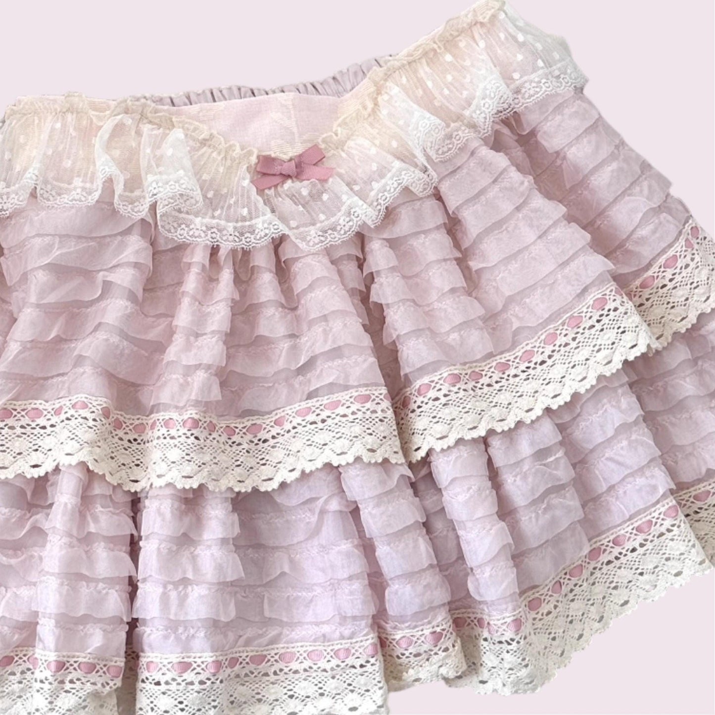 Layered lace ruffle mini skirt with intricate lace trim in soft pink3