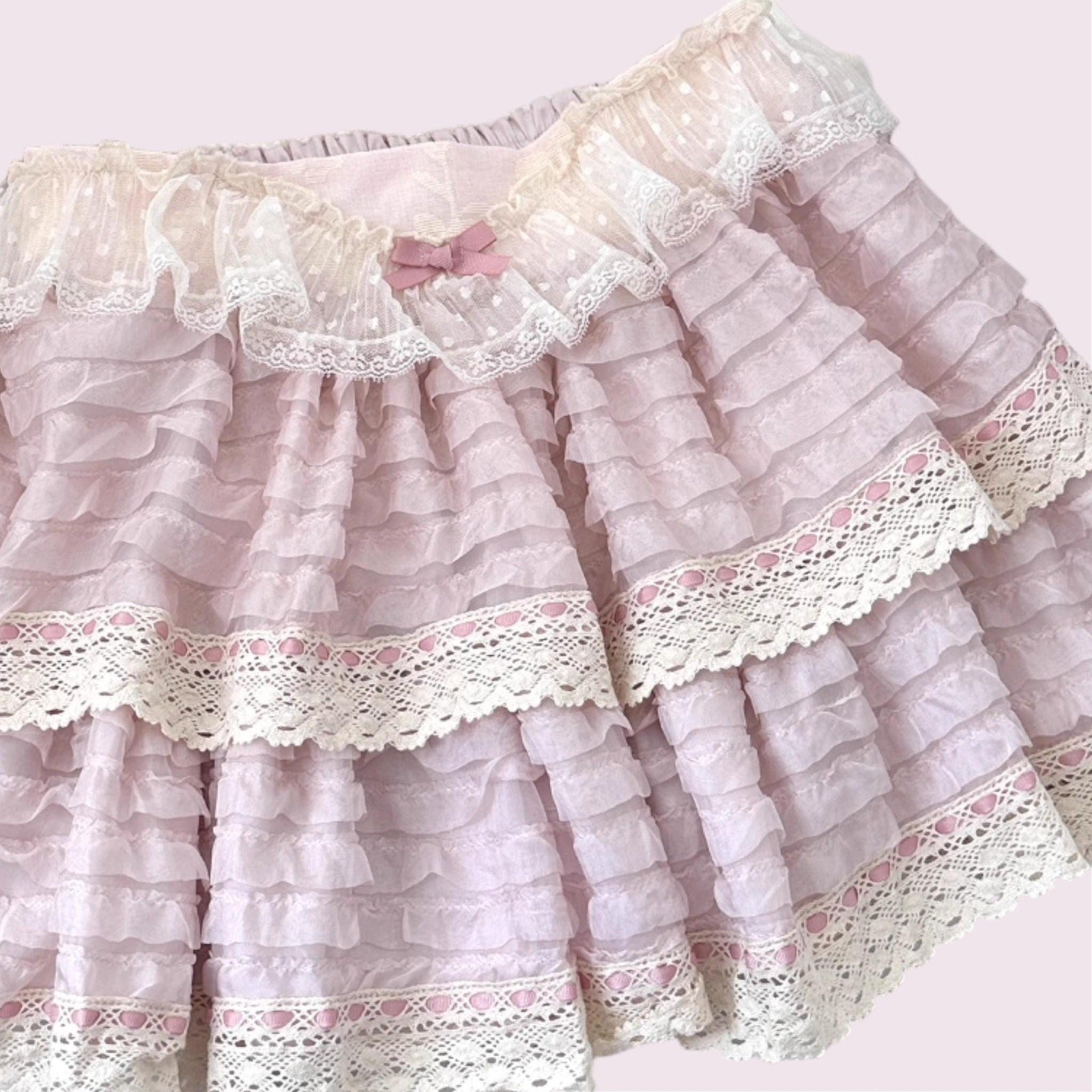 Layered lace ruffle mini skirt with intricate lace trim in soft pink3