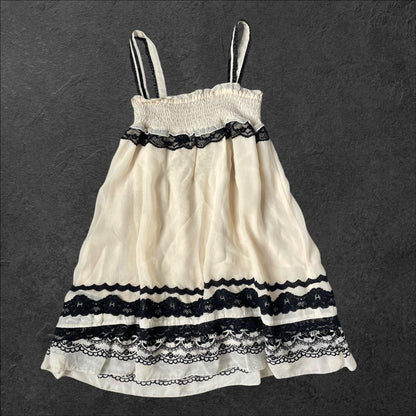 Axes Femme beige dress with rose pattern, laceup front and black lace detailing2