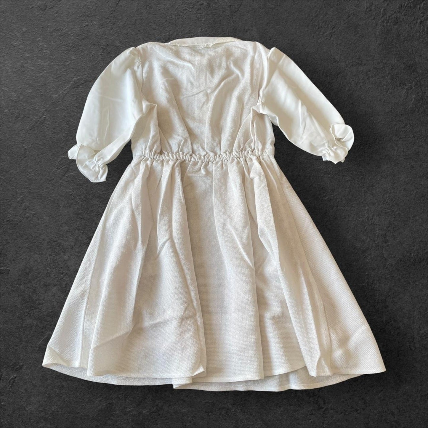 Noemie Jirai Kei ivory dress with a frilled high collar1