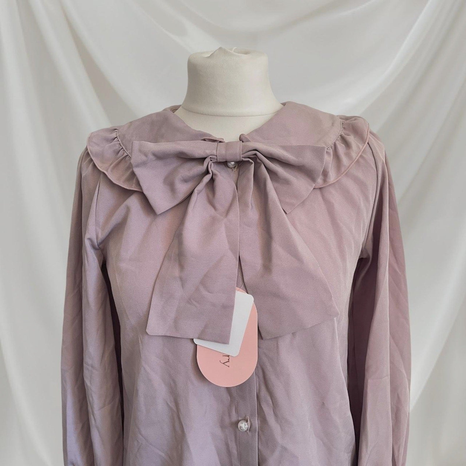 Lily Merry mauve blouse with oversized bow and ruffled collar1