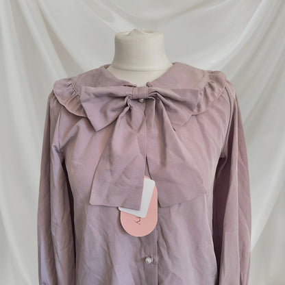 Lily Merry mauve blouse with oversized bow and ruffled collar1