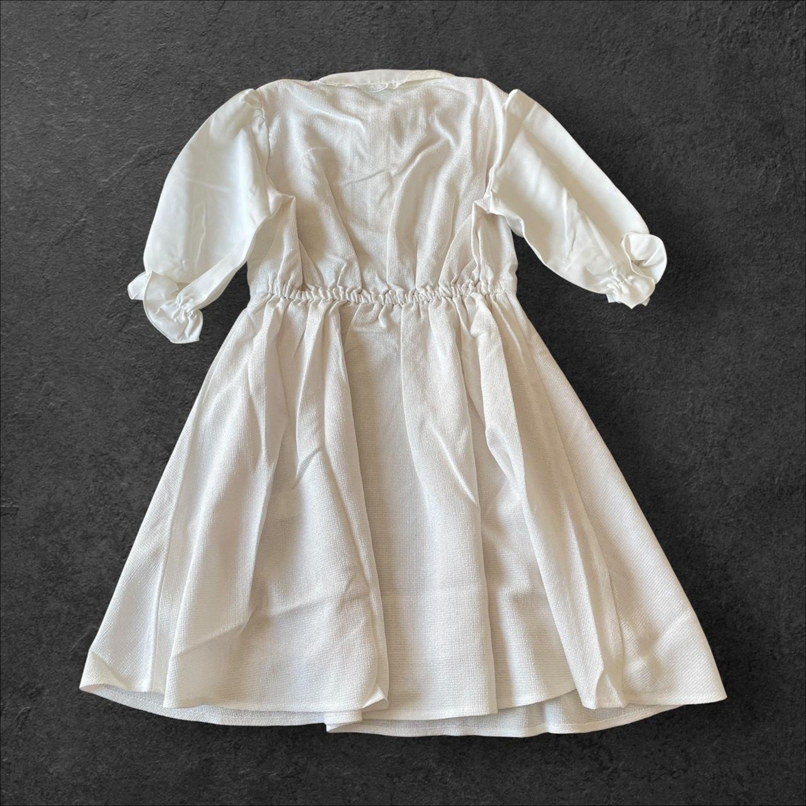 Noemie Jirai Kei ivory dress with a frilled high collar2