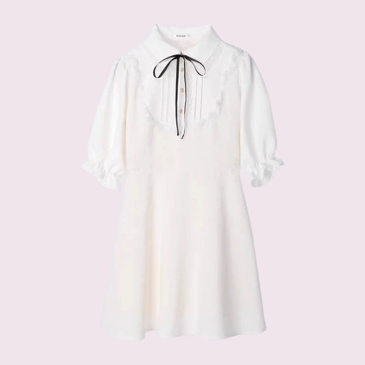 Noemie Jirai Kei ivory dress with a frilled high collar0
