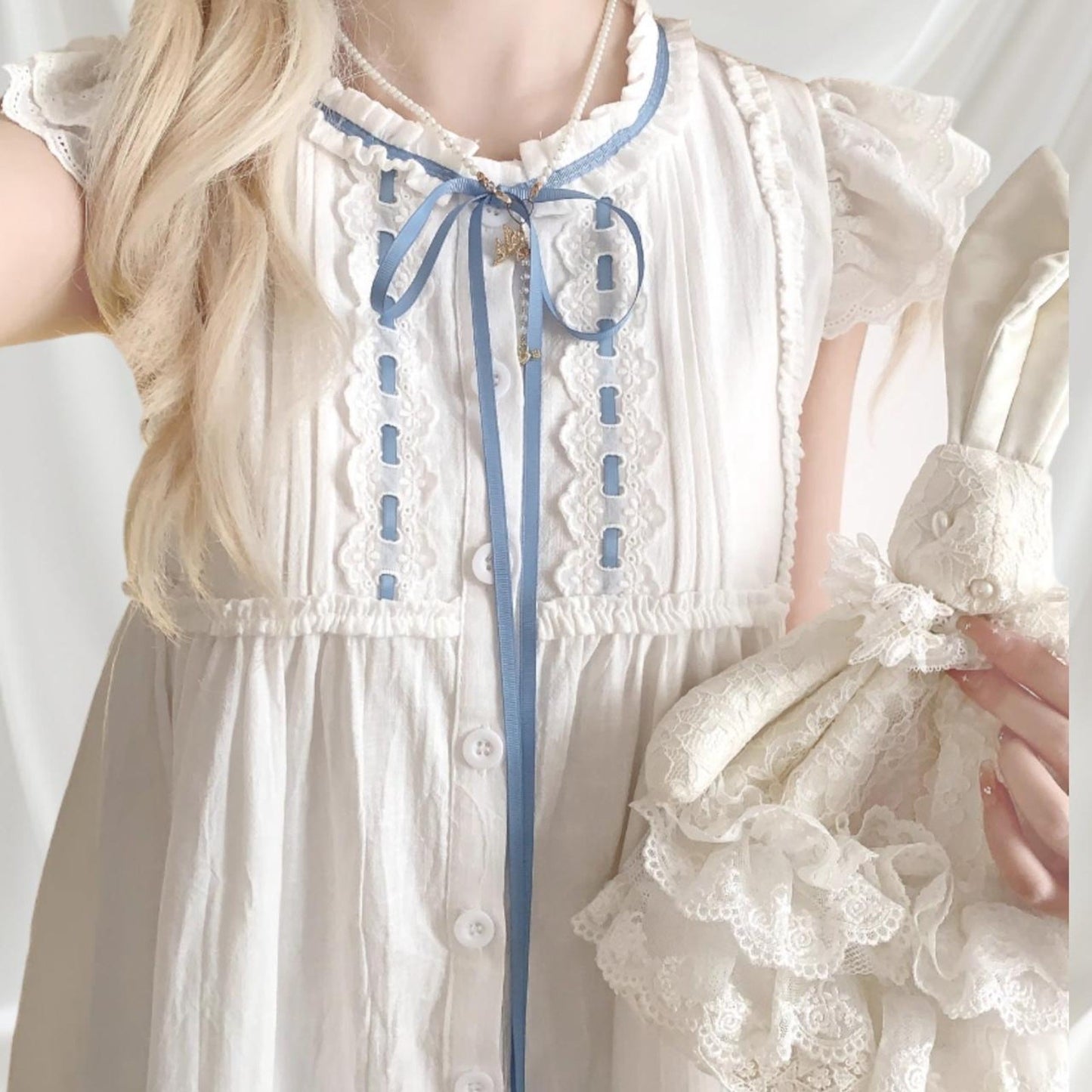 White cotton dress with blue ribbon and lace detail1
