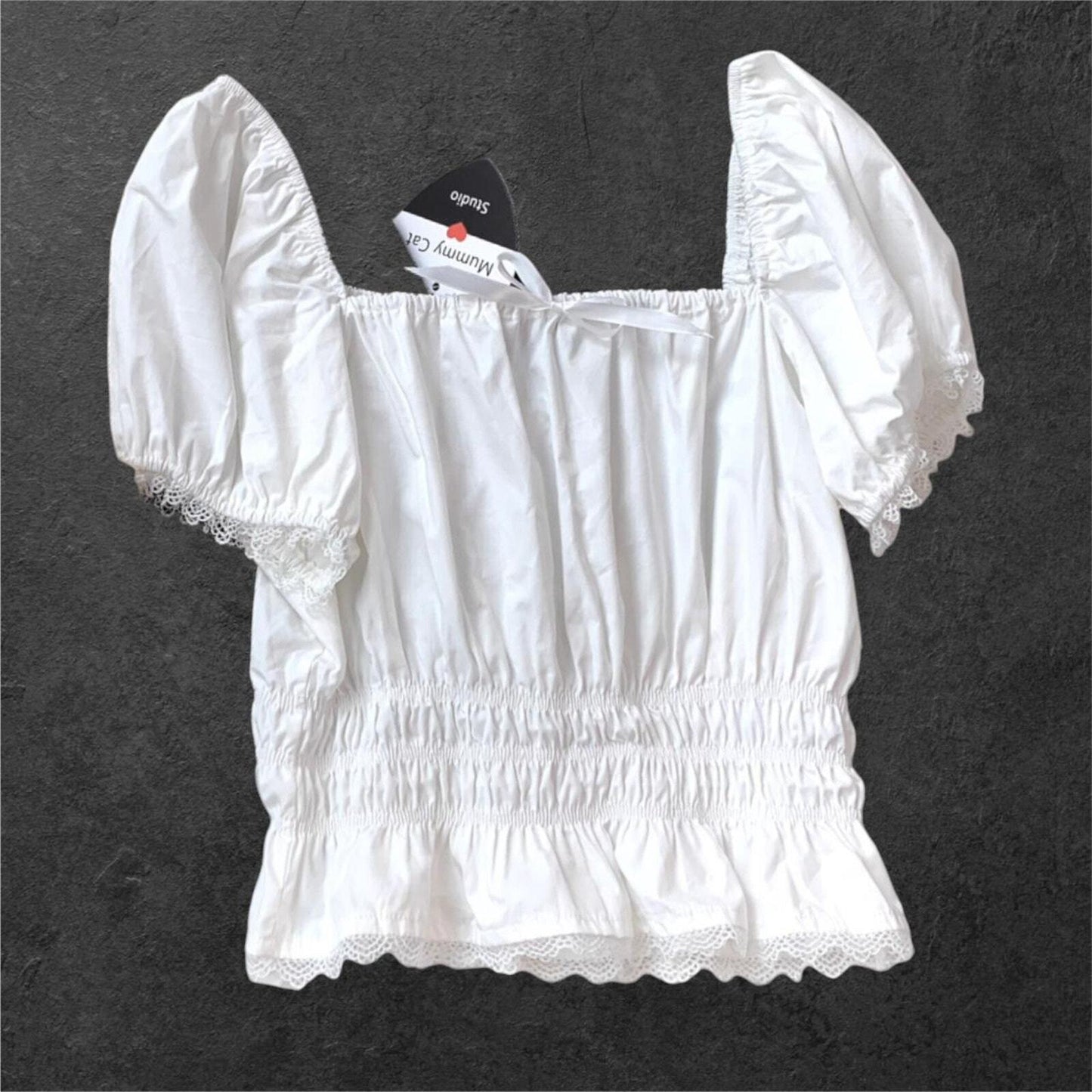 White blouse with puffy sleeves and lace detailing0