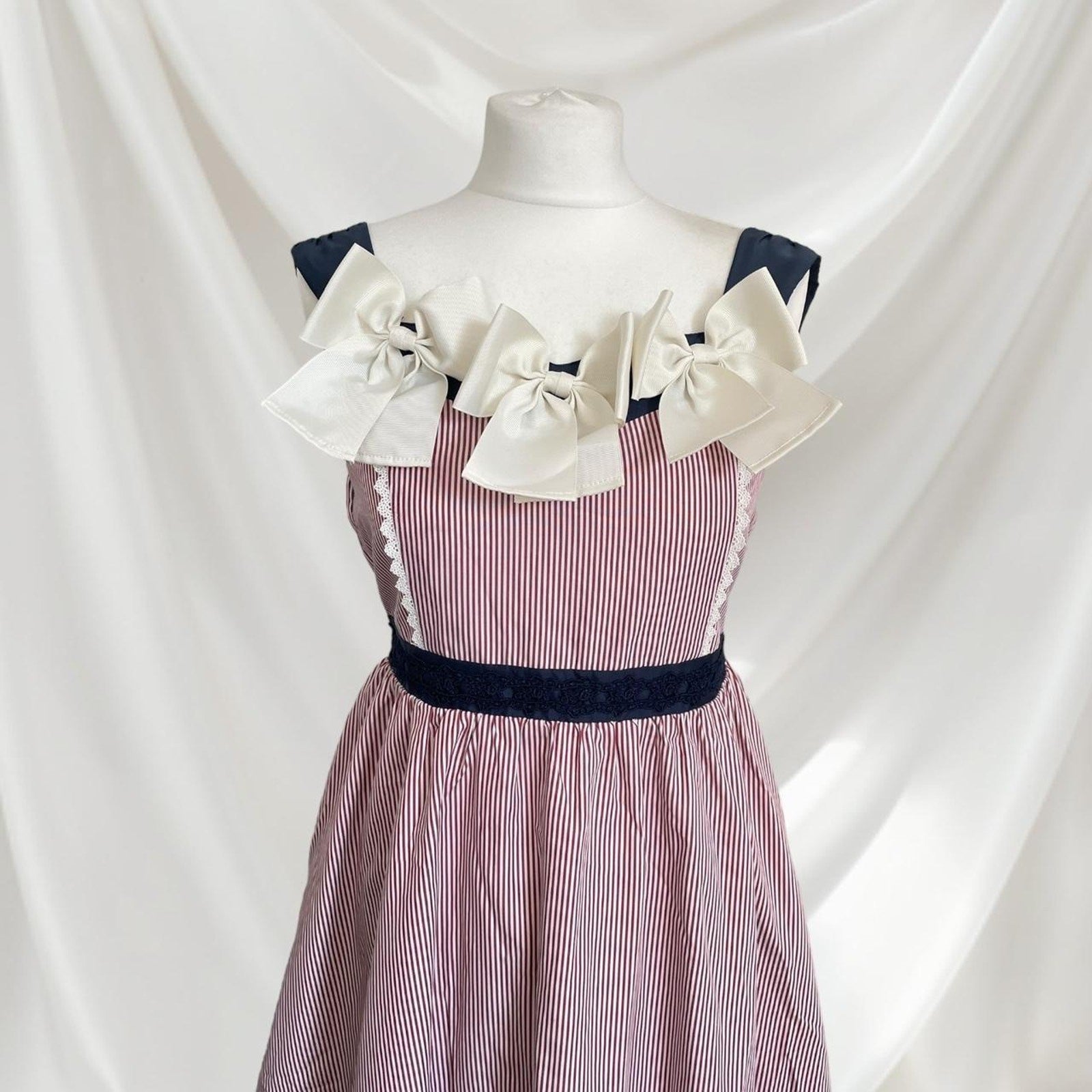 Axes Femme striped dress with statement bows 1