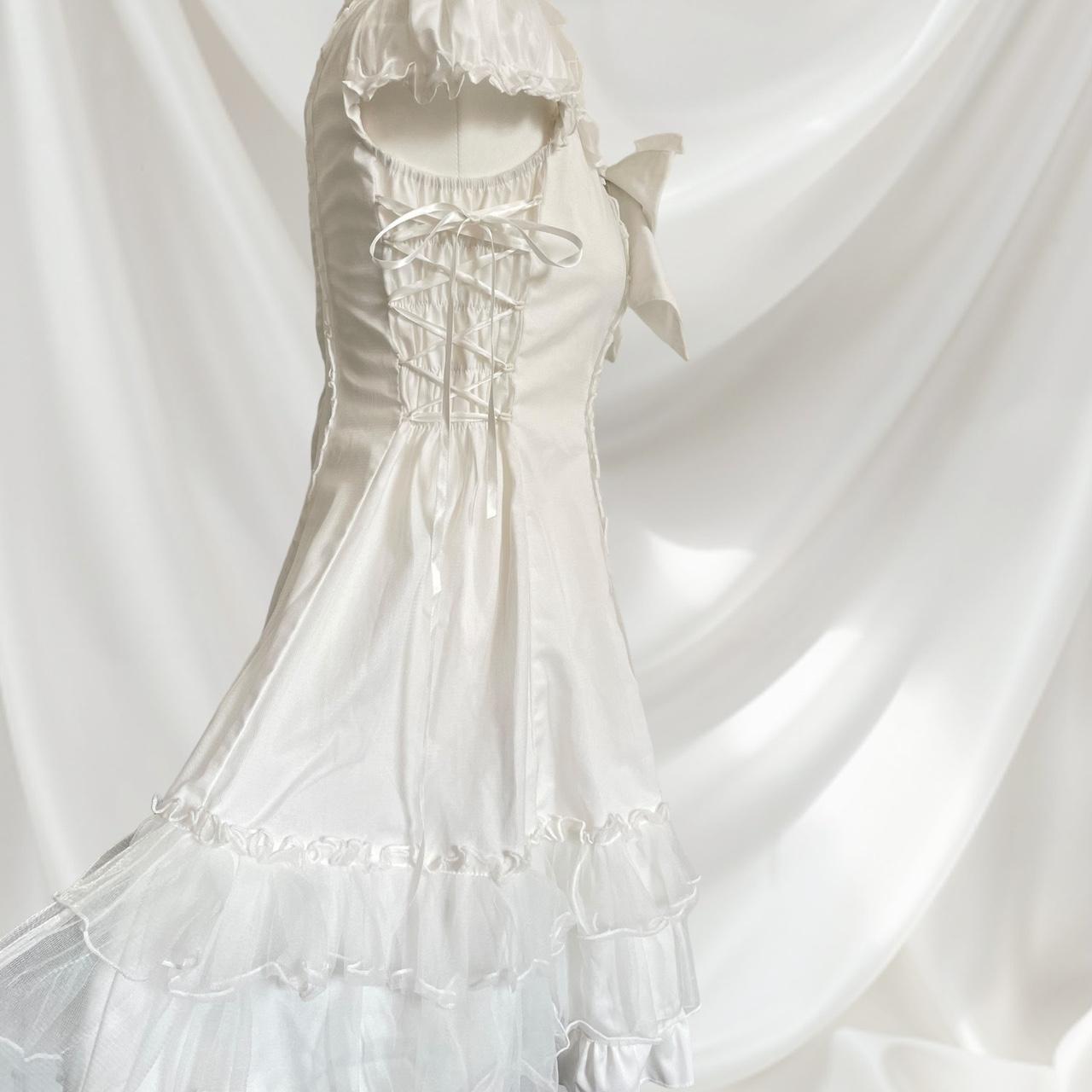 Bodyline white dress with a detachable bow and cross-tie detail4