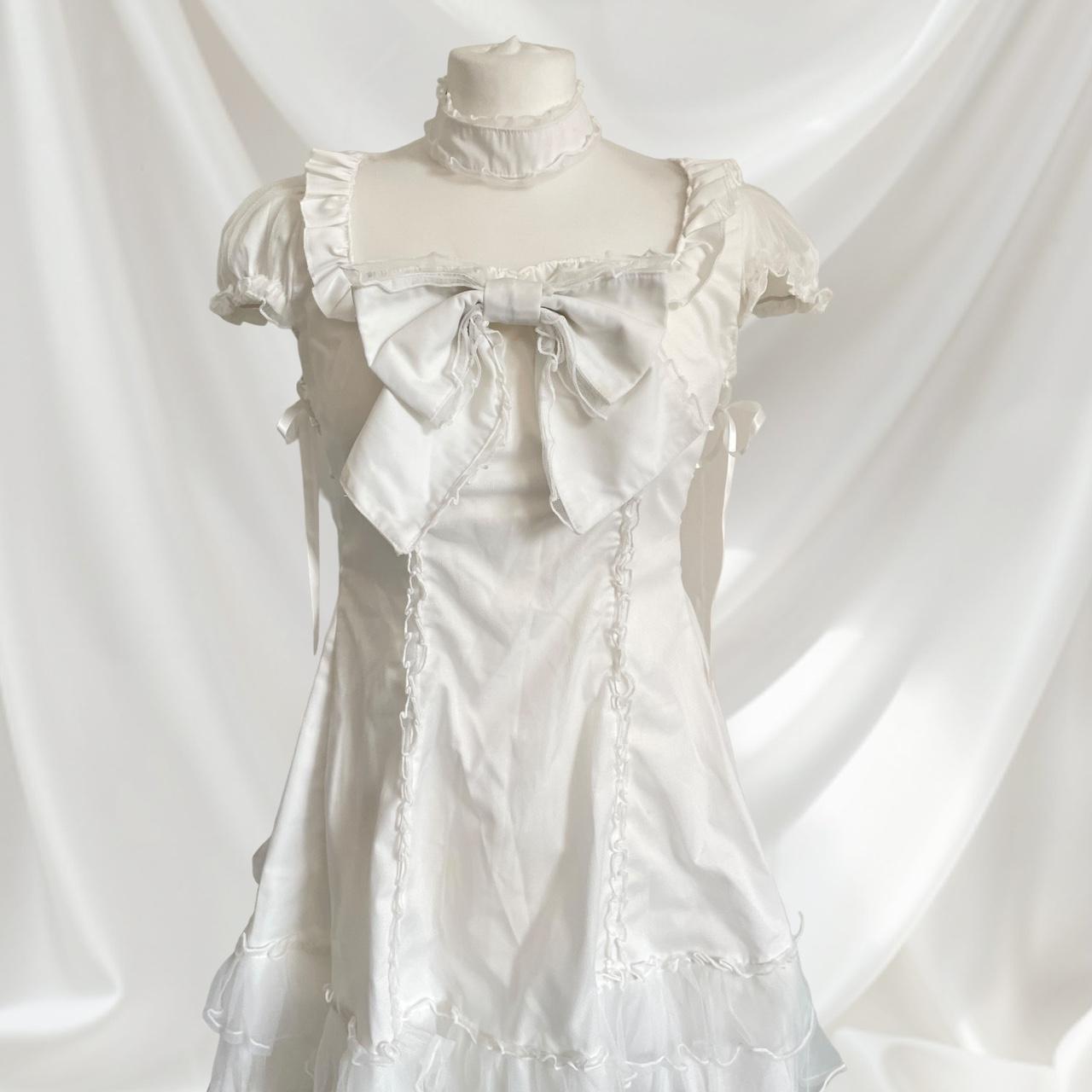 Bodyline white dress with a detachable bow and cross-tie detail3