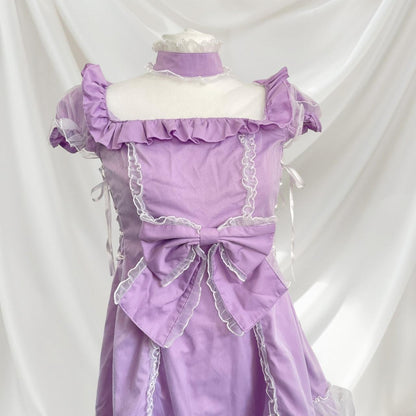 Bodyline lilac dress with ruffled hem dress with a bow and cross-tie detail 4